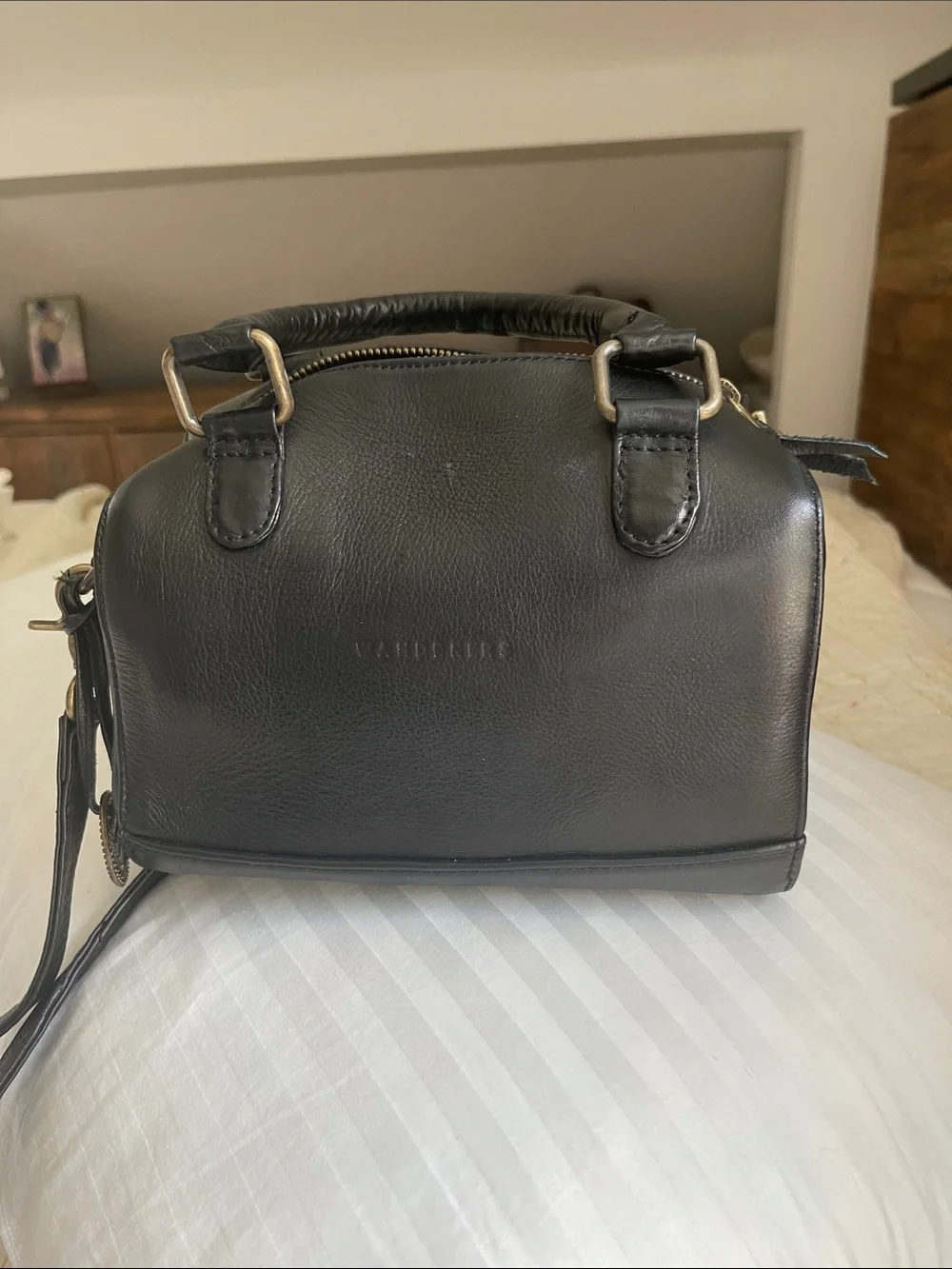 Black Leather Satchel with Top Handles and Crossbody Strap